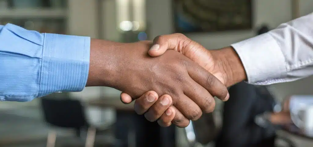 Two people shaking hands.