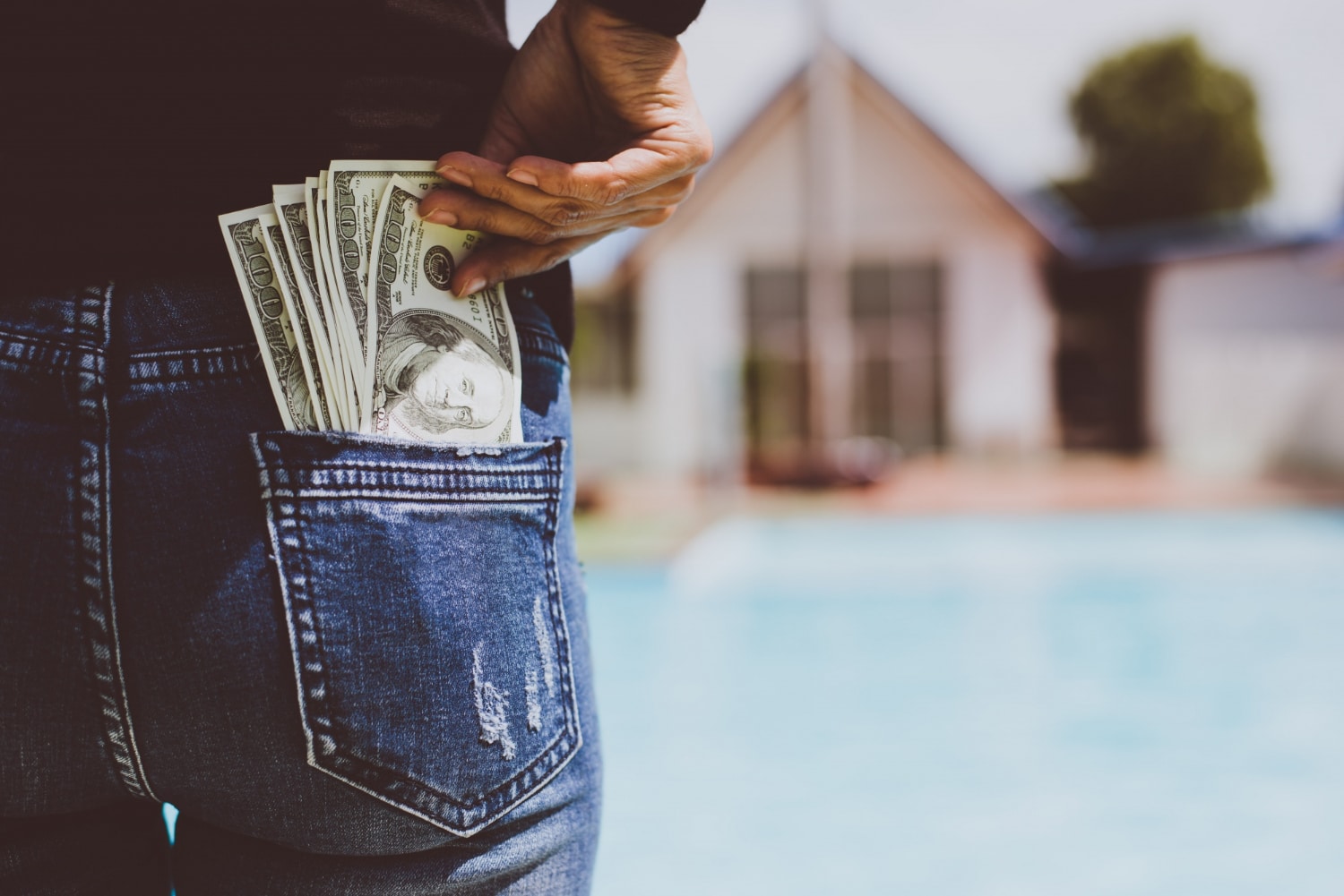 Money tucked into a back pocket.