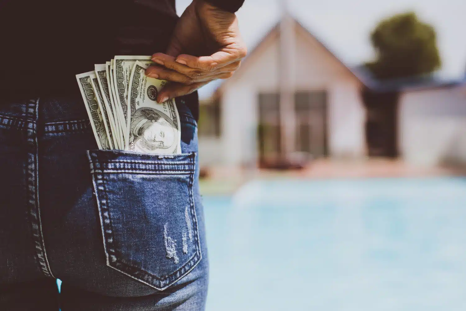 Money tucked into a back pocket.