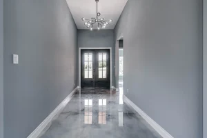 Elegant hallway with reflective marble flooring.