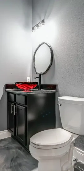 Luxury Home Builder in Boerne, TX 6 Modern bathroom with red glass sink.
