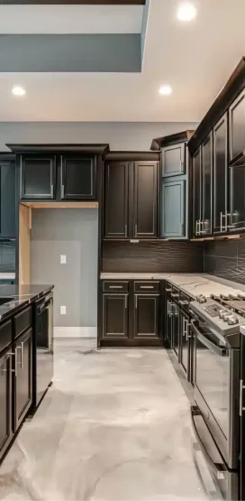 Luxury Home Builder in Boerne, TX 10 Sleek black kitchen with marble countertops